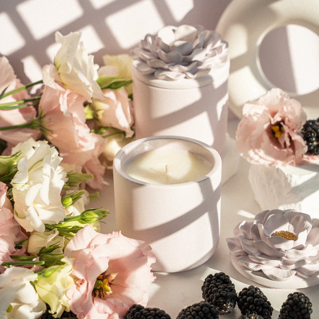 Scented soy candle in elegant gypsum container with floral lid