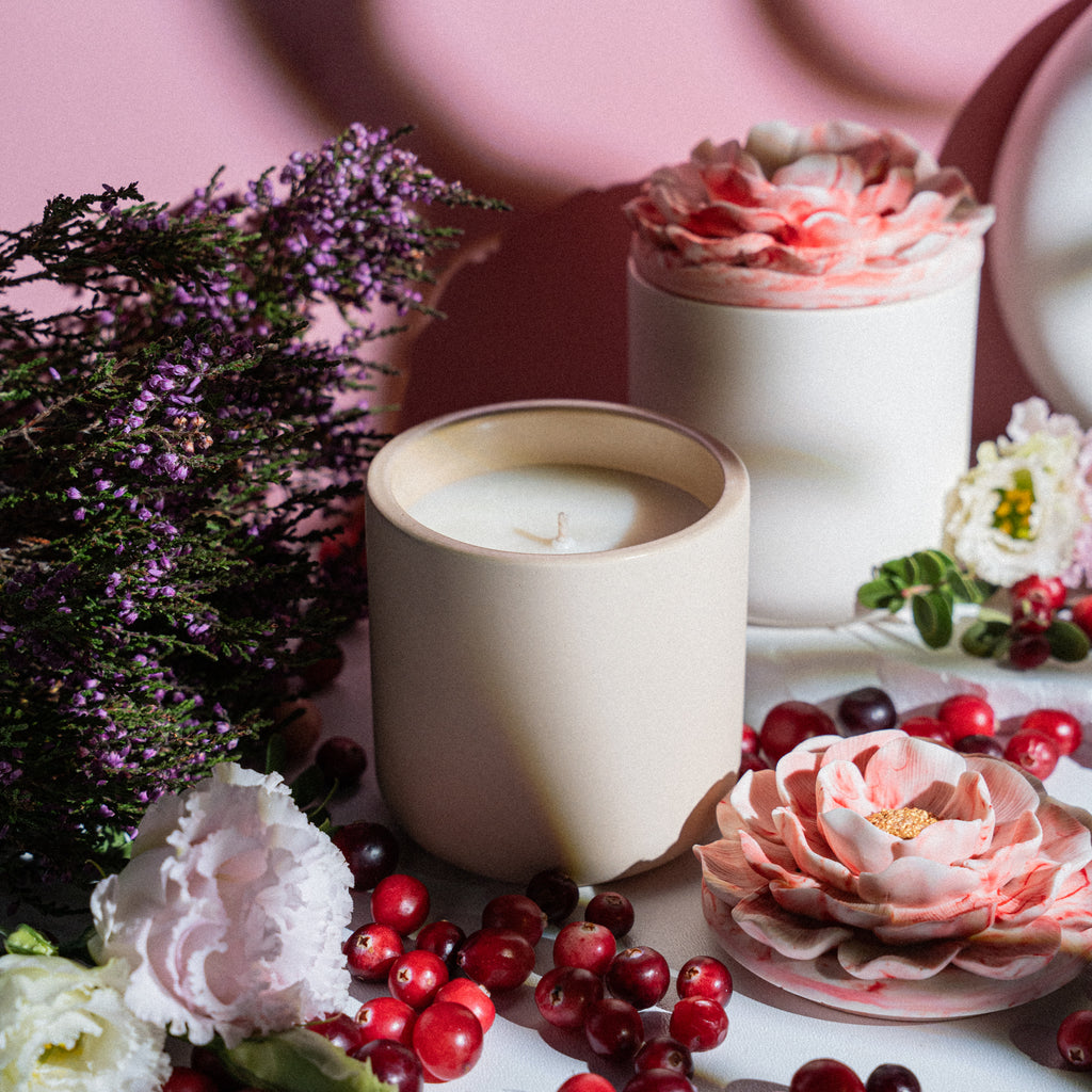 Decorative red berry candle with herbal and woody undertones