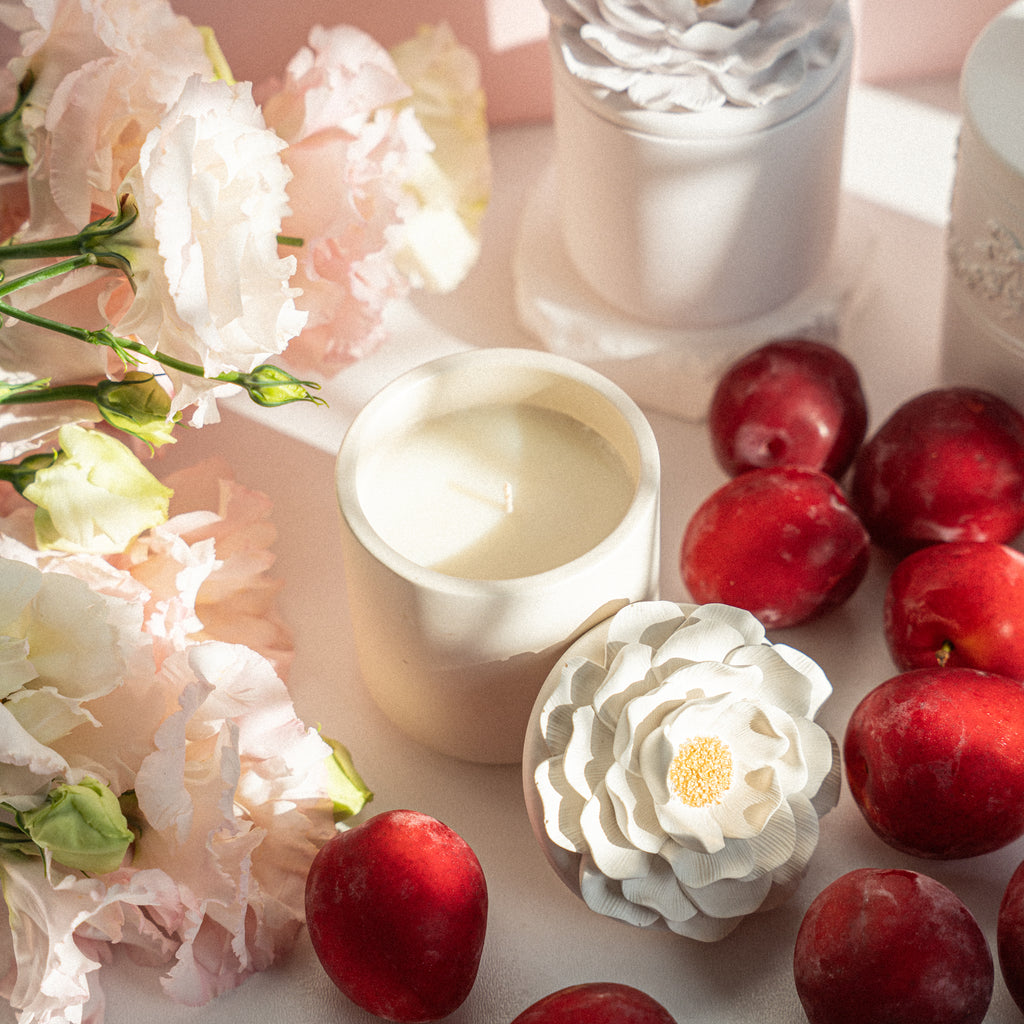 Elegant soy wax candle with citrus, cherry, and plum fragrance