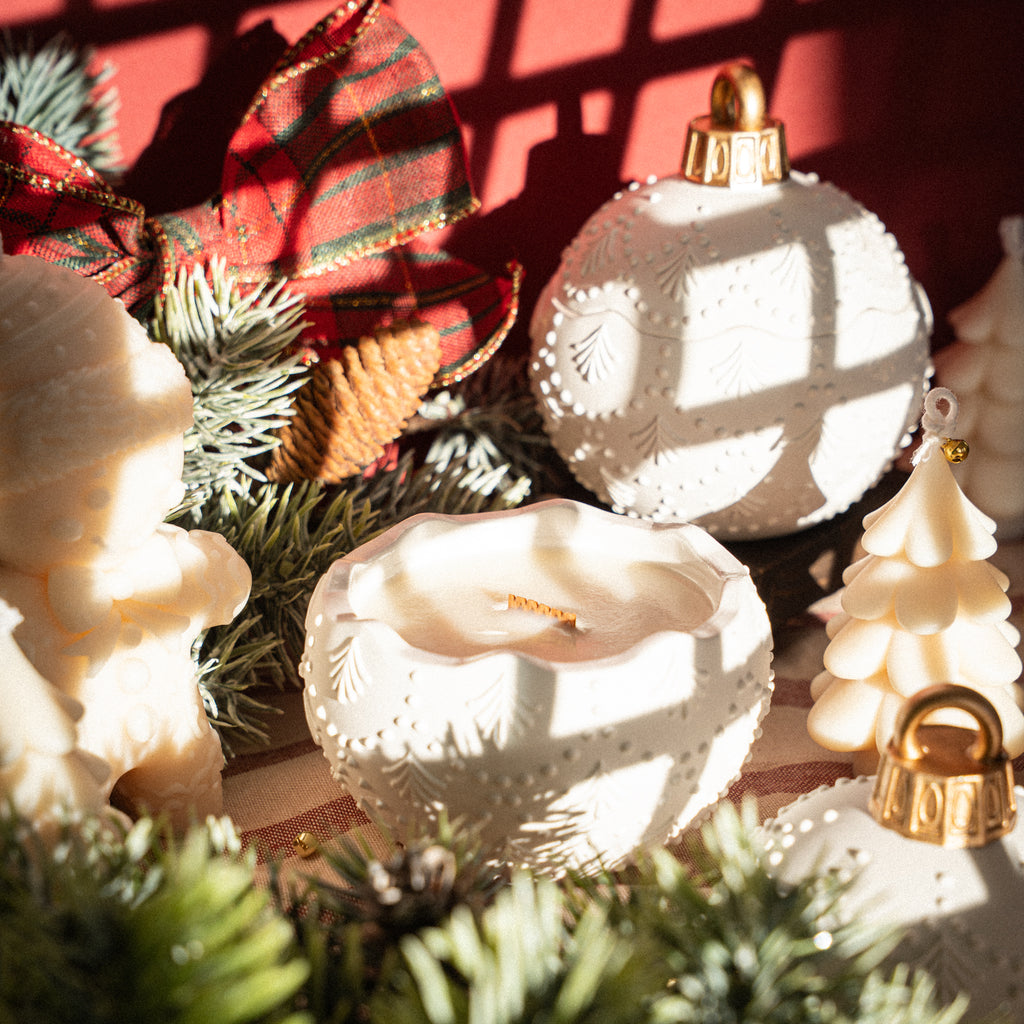 Gypsum ornament jar candle, accented with gold-trimmed ribbon for festive luxury

