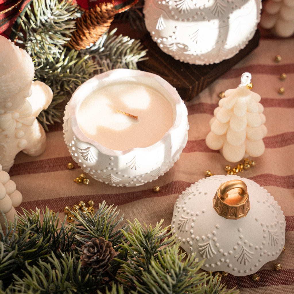 Artisan white Christmas candle in ornament jar, perfect for winter gifts