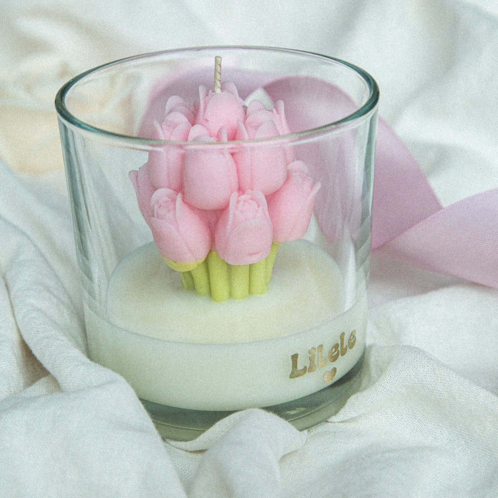 Luxury handmade soy wax candle with soft pink tulips in a glass jar, crafted by Lilele Studio